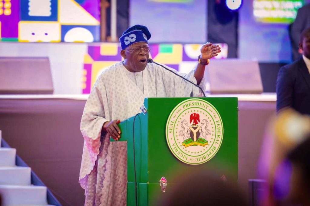 A photo of Tinubu delivering a speech